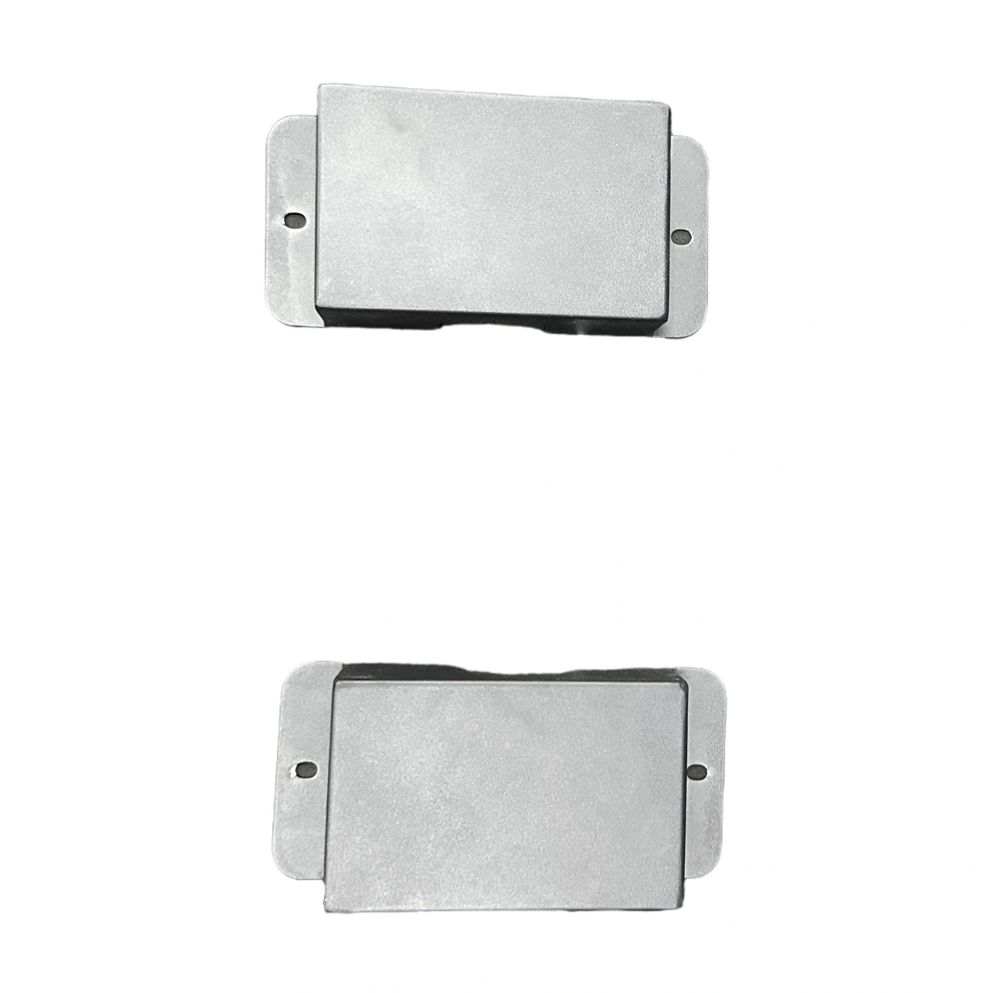 Two rectangular metal filters on a white background