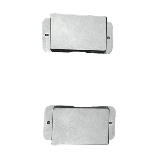 Two rectangular metal filters on a white background