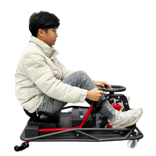 Person using a small electric go-kart on a white background